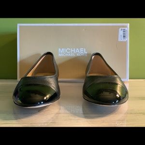 Flat black shoes by Michael Kors